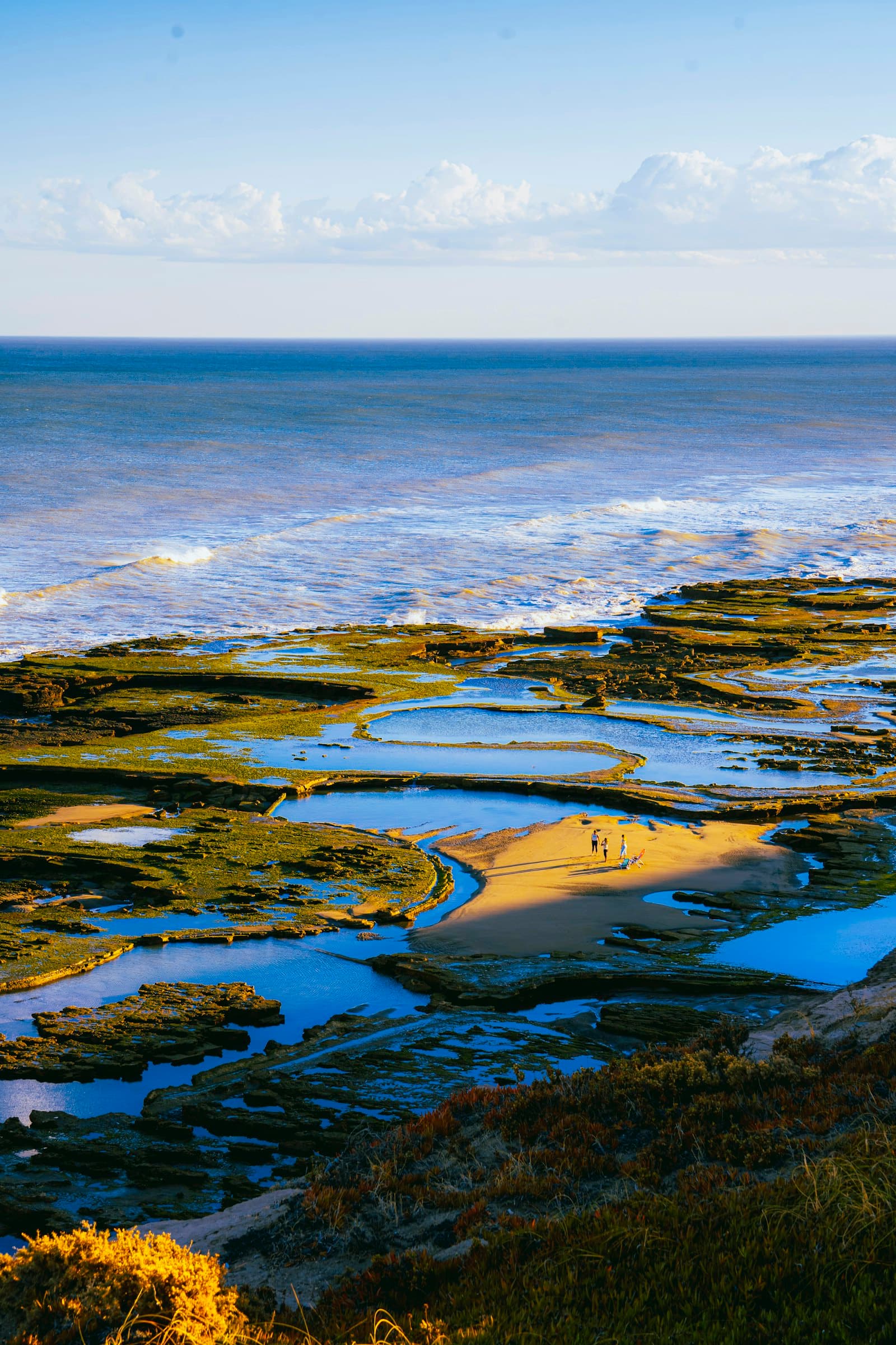 Rocky coastline with tide pools and ocean waves